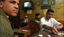 Young Iraqis playing dominoes